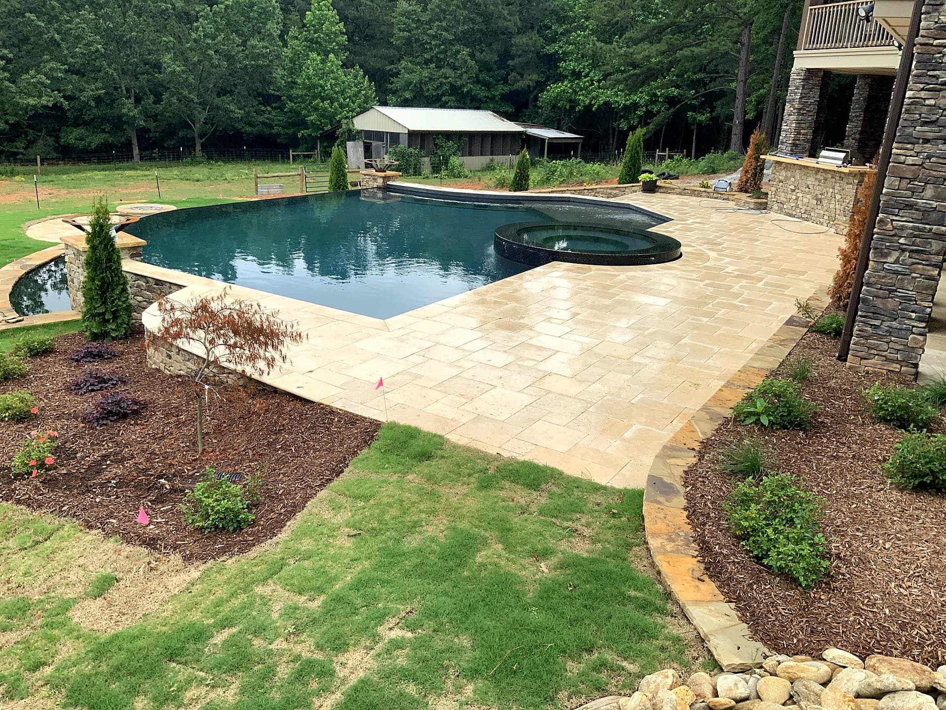Luxury infinity pool by Blue Waters Construction Charlotte